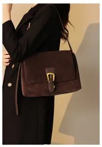 Elegant brown suede shoulder bag for women, chic crossbody bag with stylish gold buckle.