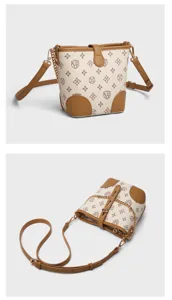 Classic monogram bucket bag with brown leather trim and chain strap, stylish design.