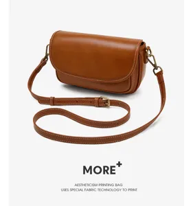 Vintage brown leather crossbody bag for women, stylish casual shoulder handbag with wide strap.