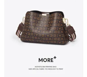 Stylish women brown monogram bucket bag with chic web strap and spacious main compartment.