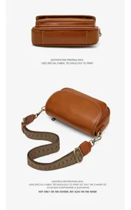 Retro brown leather shoulder bag detail view with wide woven strap and clean finish.