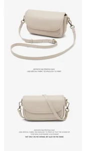 Detail view of the elegant beige minimalist vintage crossbody bag with adjustable wide strap.