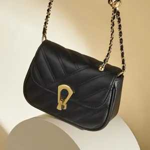 Black quilted chain crossbody bag for women, elegant mini shoulder bag with gold hardware.