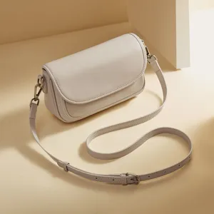 Minimalist leather crossbody shoulder bag for women, chic neutral tone everyday purse.