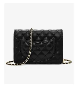 Black quilted leather shoulder bag detail, elegant chain strap and classic flap design.