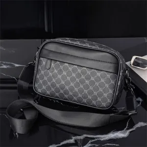 Detailed view of men's monogram crossbody bag, dark grey vintage pattern leather trim texture.