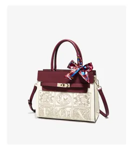 Burgundy and white women top handle shoulder bag with scarf charm and letter print design details.
