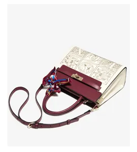 Elegant burgundy and cream handbag with stylish scarf, chic shoulder crossbody design.