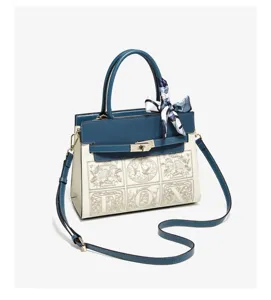 Elegant blue and white colorblock handbag with stylish scarf decor and shoulder strap.