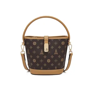 Retro brown monogram bucket bag for women, luxury leather trimmed shoulder and crossbody bag.