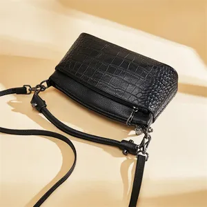 Black leather shoulder crossbody bag with crocodile texture flap, stylish commuter handbag.