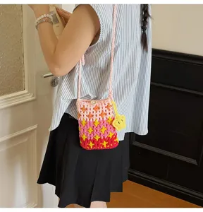 Handmade crochet crossbody phone bag with vibrant gradient colors and cute flower charm for women.