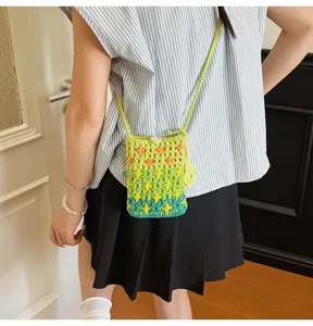 Knitted crossbody phone bag for women, cute crochet mini shoulder bag with star pattern.