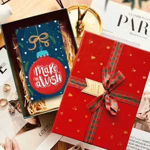 Christmas gift box greeting card detail scene featuring red box and festive wish card.