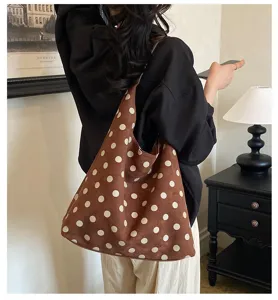 Brown polka dot suede shoulder bag detail, vintage tote bag style for women commuting.