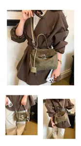 Olivgrüne Wildleder Handtasche mit Henkel und Schulterriemen, elegantes Design für Pendler.