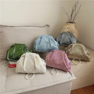 Exquisite pearl embellished ruched clutch bag detail showcasing various color options.