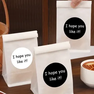 Black and white round sealing stickers with baking bread bag design, simple and elegant style.