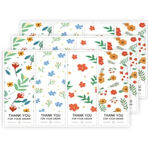 Autocollants de remerciement floraux rectangulaires pour sceller les boîtes cadeaux.