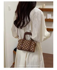 Brown polka dot Boston handbag, stylish retro commuter shoulder bag for women daily use.