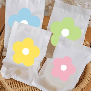 Cute colorful flower paper bags for biscuit dessert packaging, pastel aesthetic design.