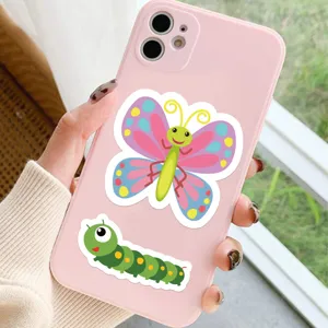 Detailed showcase of cute cartoon insect butterfly and caterpillar stickers on a pink phone case.
