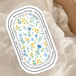 Ovale Blumen-Siegelaufkleber mit gelben und blauen Blüten, ideal für Geschenkboxen.