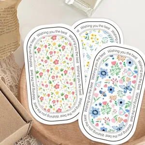Blumige ovale dekorative Aufkleber für Geschenkschachteln und Siegel mit schönen Motiven.