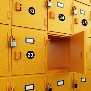 Black round number stickers applied on yellow storage lockers for easy item organization.