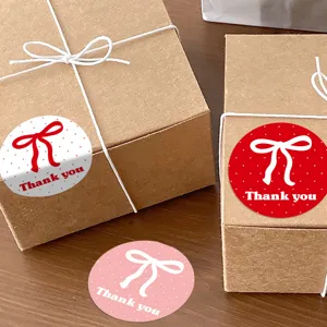 Round thank you sealing stickers with cute bow design, perfect for gift box packaging and sealing.