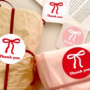 Round thank you stickers with red bow and polka dots, perfect for gift wrapping and seal labels.