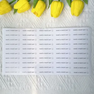 Detail shot of long strip sticker sheet with English text and smile face for daily decoration.