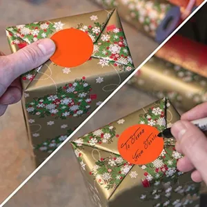Detail view of orange round dot stickers for gift marking and writing notes easily.