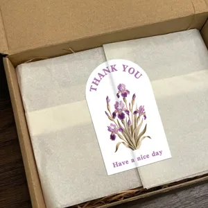Detail view of decorative floral sealing sticker with arch design and iris flower pattern.