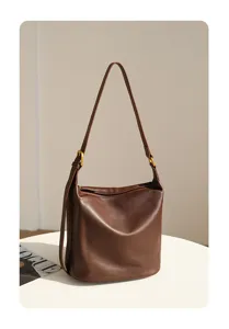Brown soft leather hobo shoulder bag, large capacity daily casual handbag with metallic buckle.