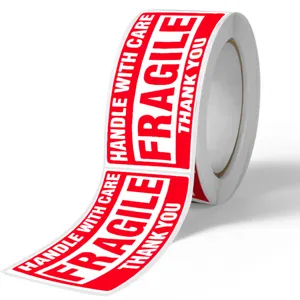 Fragile warning tape roll, red and white adhesive label for shipping packages, clear text.