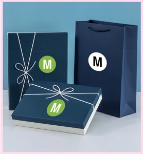 Clothing size label stickers M size garment labels for retail shops and apparel packaging use.