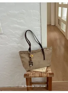 Élégant sac cabas fourre-tout en suédine pour femme, grand sac d'épaule au design rétro.