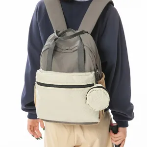 Sac à dos décontracté pour femme, grand cartable de voyage colorblock avec poche avant.