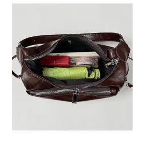 Brown leather underarm shoulder bag with multi-pocket design, large capacity commuting bag.