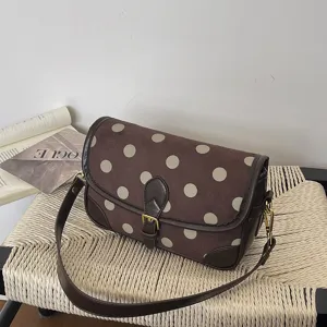 Stijlvolle vintage bruine stippen schoudertas met leren afwerking en retro design.