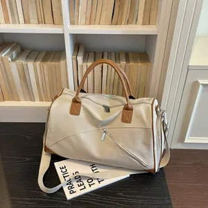 Grand sac de voyage en toile pour femme, sac de sport week-end léger avec bandoulière pratique.