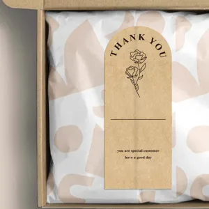 Kraft paper thank you sticker label detail, arched floral design for gift packaging box.