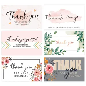 Detail view of pink floral thank you cards, elegant watercolor designs for gift packaging inserts.