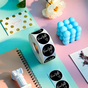 Round black self adhesive sticker roll with free gift print for gift sealing packaging decor.