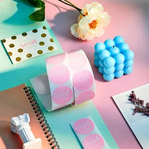 Pink round roll stickers with free gift text, perfect for packaging, sealing and cute decor.