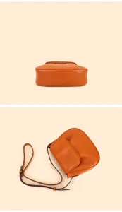 Brown leather saddle bag, chic crossbody shoulder bag detail view, elegant daily casual purse.