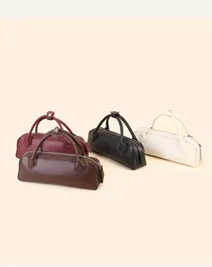 Details and close-up view of the minimalist leather Boston pillow handbag showing fine textures.