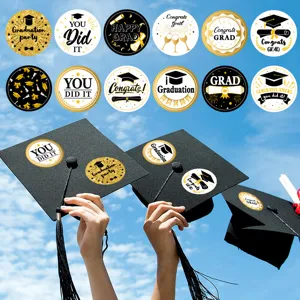 Graduation round stickers detail view, gold black sealing labels for party celebration decor.