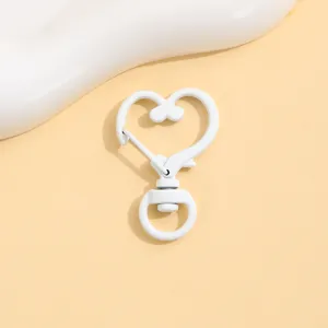 White heart-shaped lobster clasp detail shot, zinc alloy baking paint DIY jewelry accessory.